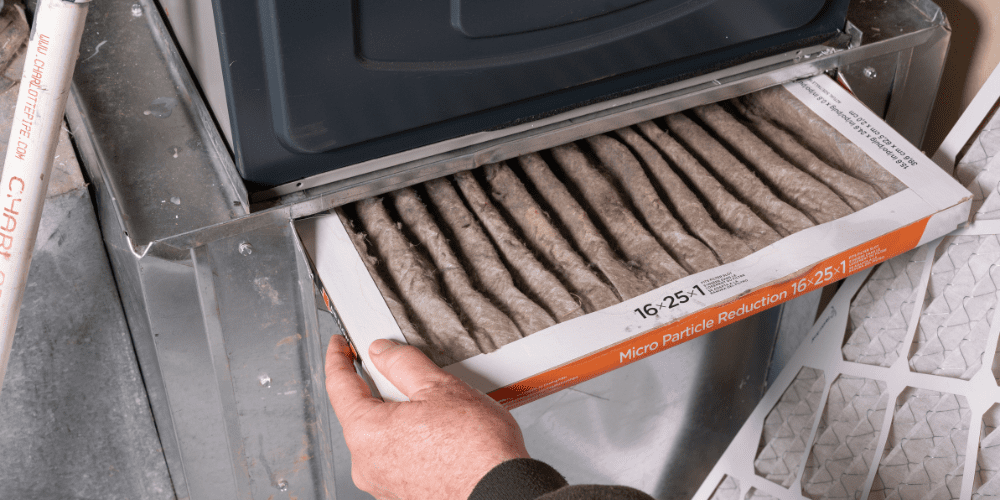 Changing the filter of your HVAC system - 4 Ways to Extend the Lifespan of Your HVAC System - Allen Heating & Cooling